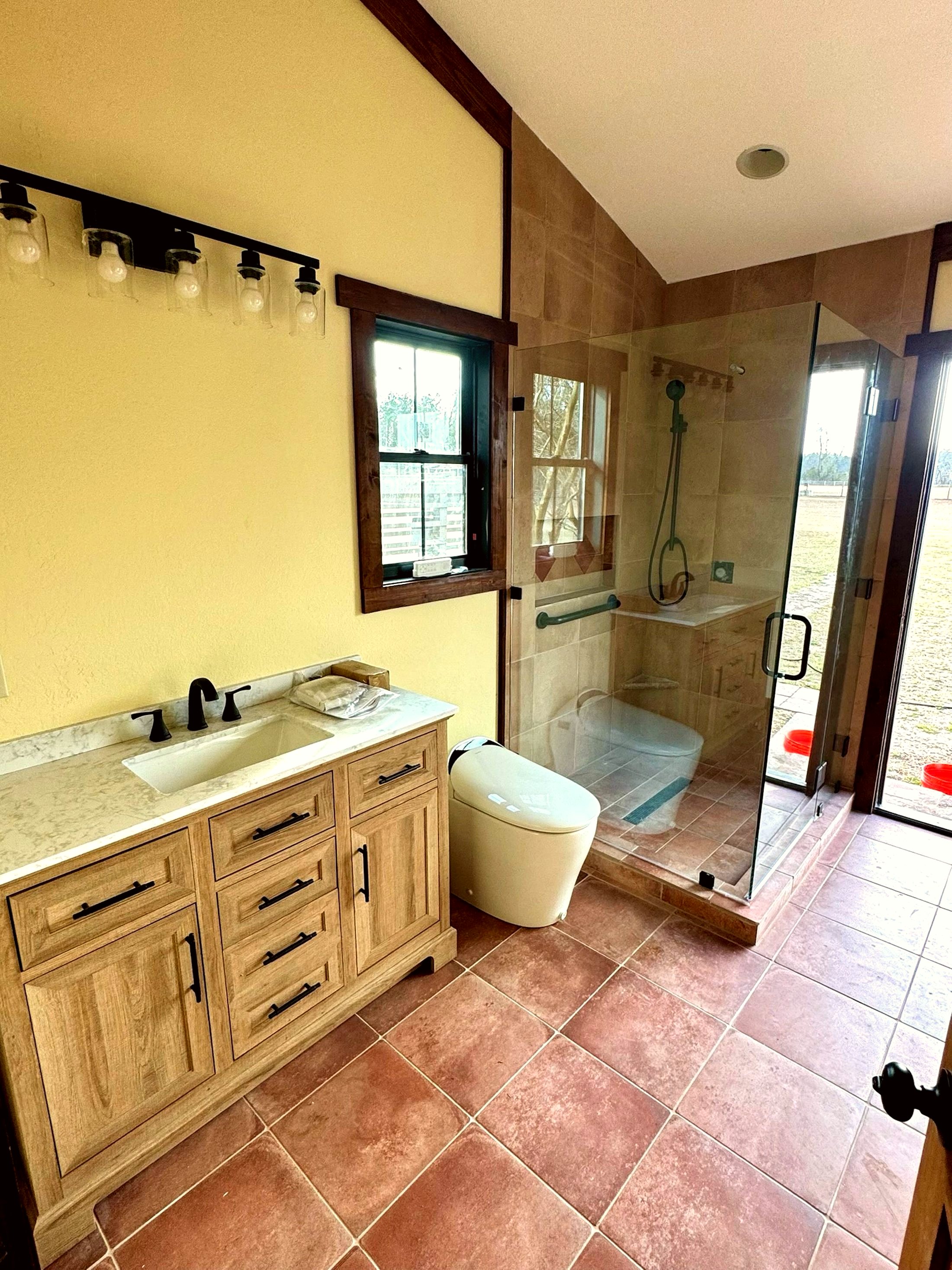 Bathroom remodel with walk-in tile shower by Wages Construction